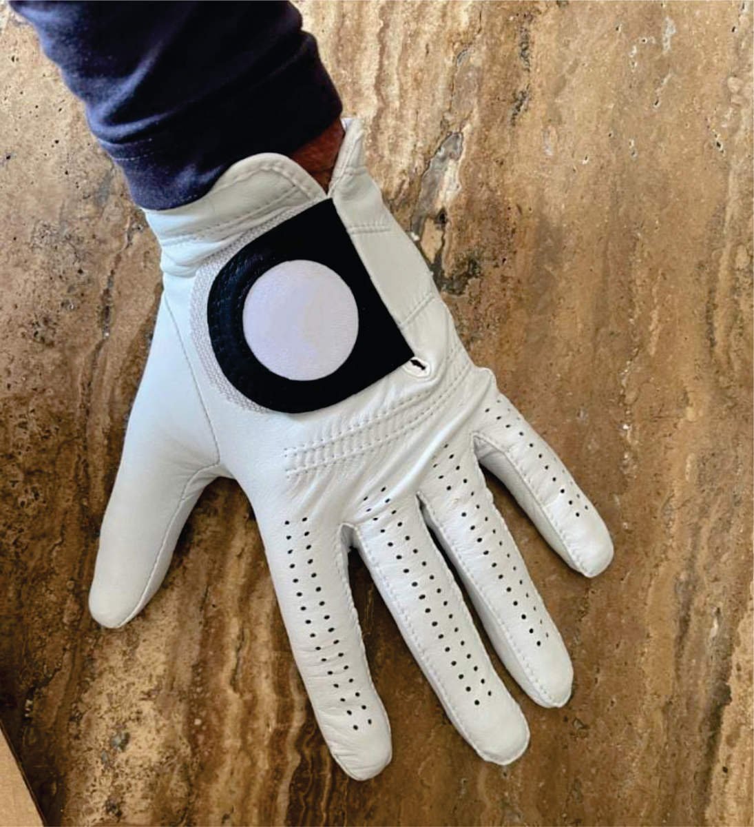 Premium sheepskin cabretta leather waterproof golf gloves in black and tan with luxury craftsmanship for winter sport play